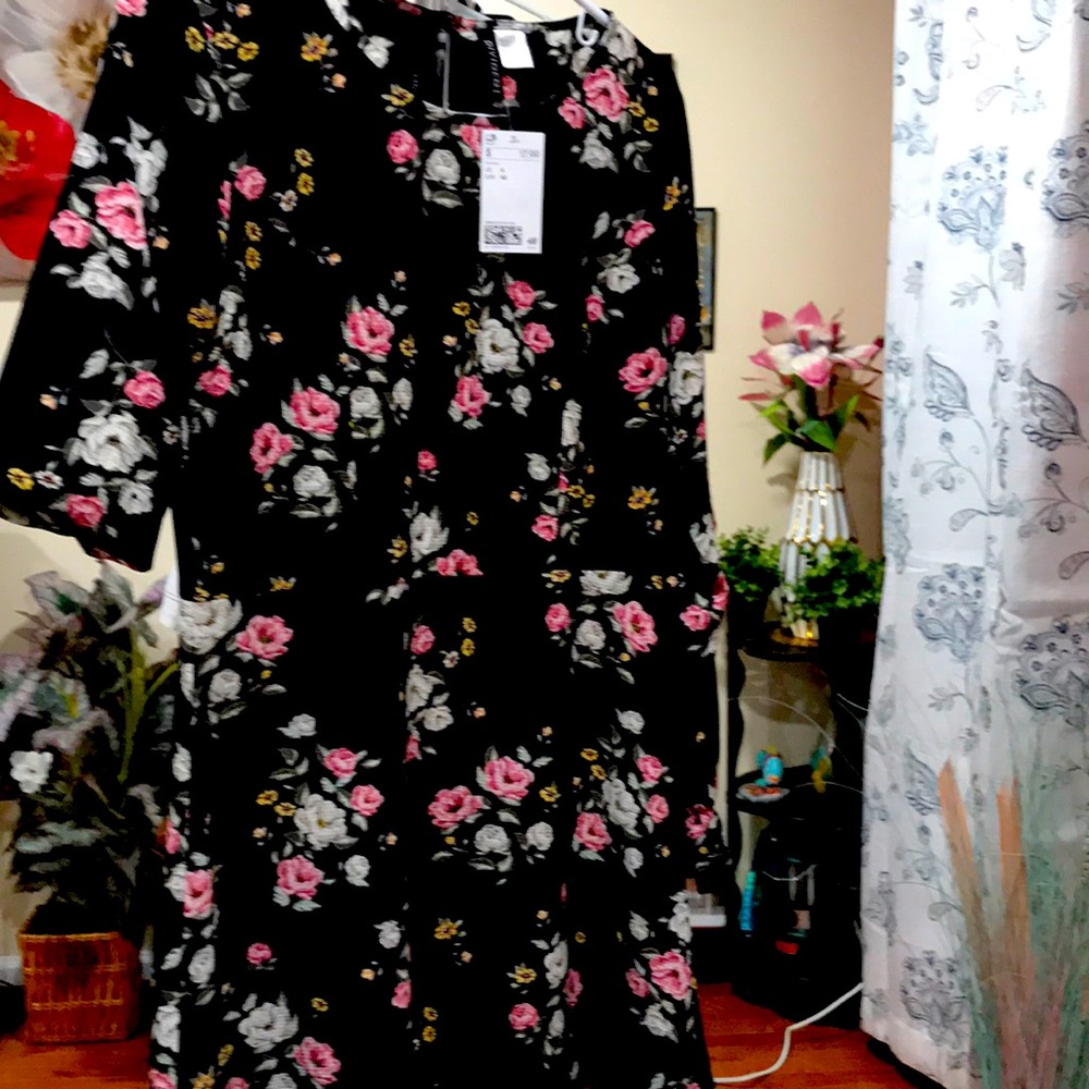 Floral dress approximately 33 in(L), 15.5in (W)
